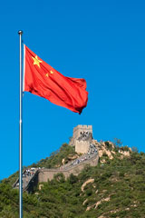 Chinese flag flying near the Great Wall of China